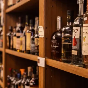 a shelf of liquor bottles