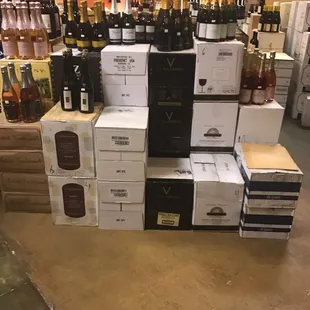 a large stack of wine bottles