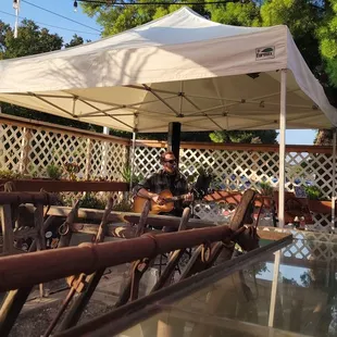 people sitting under a tent