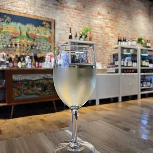 White wine with bottles for sale in background