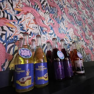 a row of bottles on a shelf