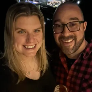a man and a woman holding wine glasses