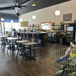 More seating and cute bar area! The lighting was actually dimmer and cozier than photographed