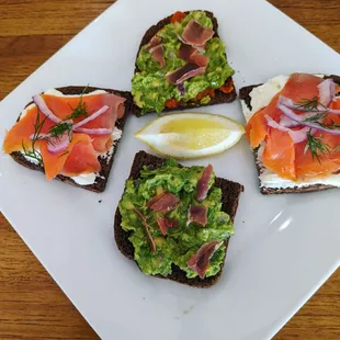 four slices of bread with various toppings