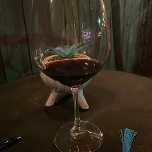 a glass of wine on a table