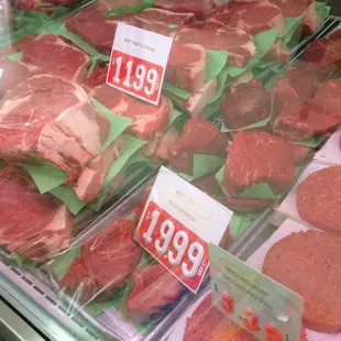 a display of meat in plastic bags