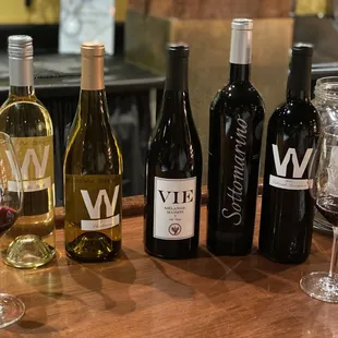 bottles of wine and glasses of wine