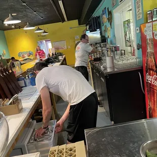 a man working in a kitchen