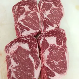 Choice Black Angus ribeyes. Aged and hand cut to order