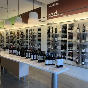 rows of bottles of wine on display