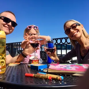 a family enjoying a glass of wine