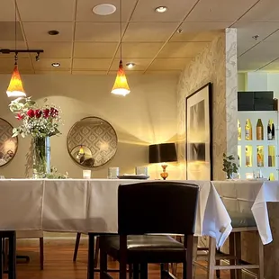 Back part of the restaurant where more communal seating is located, as well as stand-alone tables and half-booths.