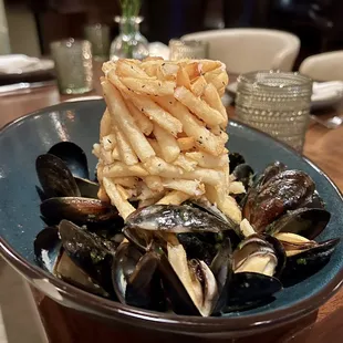 Steamed Prince Edward Island Mussels. Incredibly tender mussels covered in white wine, butter, garlic, and lemon. Comes with thyme frites.