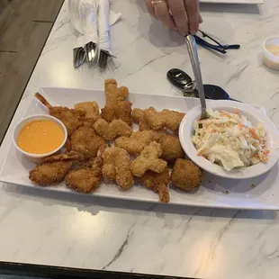Adult shrimp platter with kids meal  attractions.