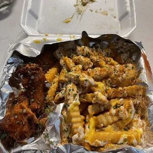 Hot Lemon Pepper wings and ranch, cheese and cajun fries