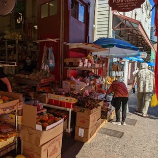 people shopping at an outdoor market