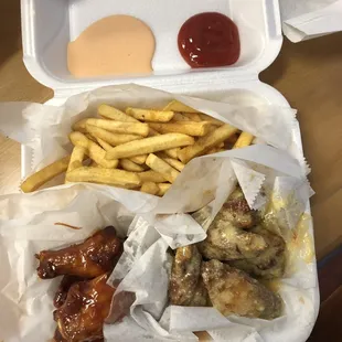 Bbq wings, garlic parmesan wings, fries, ketchup, and &quot;yum yum&quot; sauce