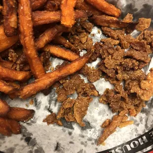 a close up of a hot dog and french fries