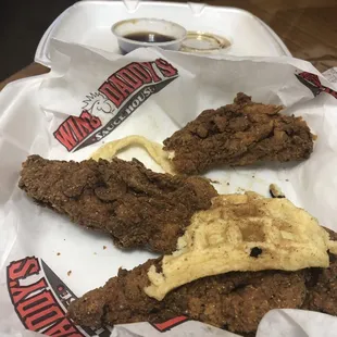 Dry burnt chicken strips and thin floppy waffle