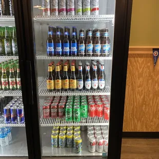 a refrigerator full of sodas and soft drinks