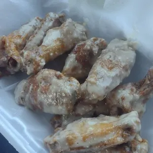 chicken wings in a styrofoam container