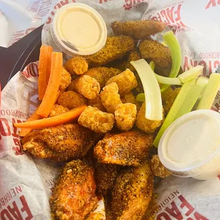 chicken wings and carrots in a basket