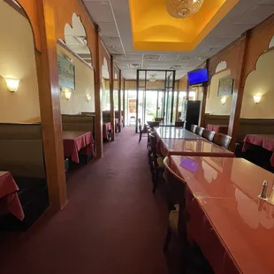 a long table and chairs in a restaurant