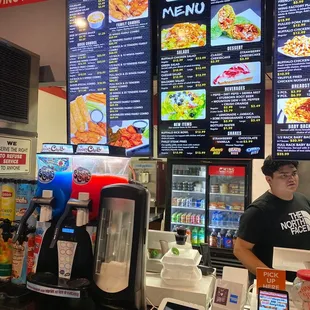 a man standing behind the counter