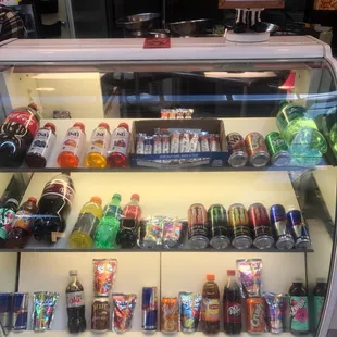 a display case filled with drinks