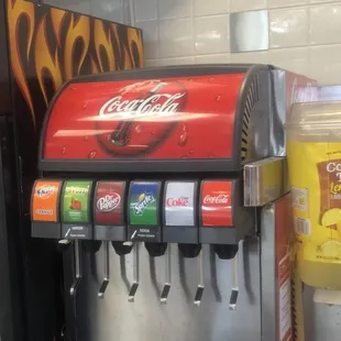a soda dispenser in a kitchen