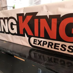 Wing King Express logo banner inside the store.