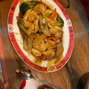 a plate of chicken and vegetables