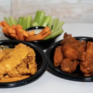 Chicken tenders, hot wings, carrots and celery