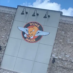 the logo on the side of the building