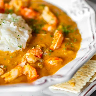 a plate of food with rice and shrimp