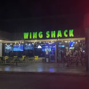 the front of the restaurant at night