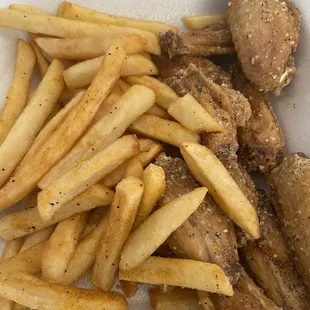 Parmesan garlic wings with seasoned fries.