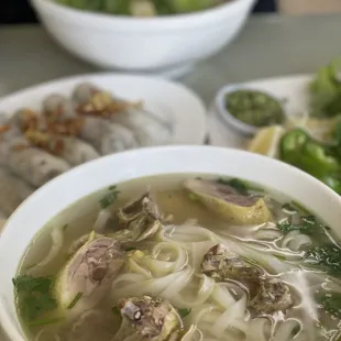 a bowl of soup and a plate of vegetables