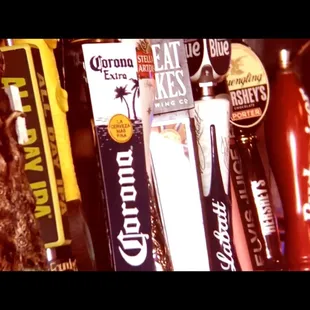 a row of beer taps