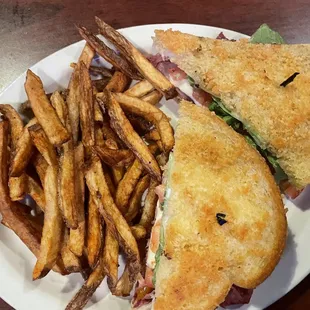 a sandwich and french fries on a plate