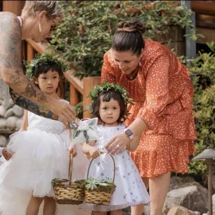 Helping flower girls walk down the aisle.