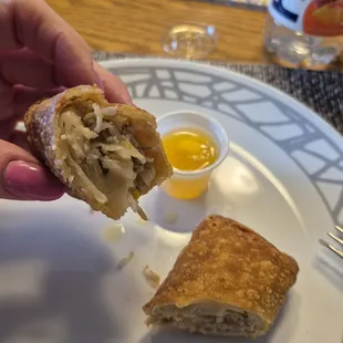 Up close of egg roll with little white powder pieces of?  1/30/2025