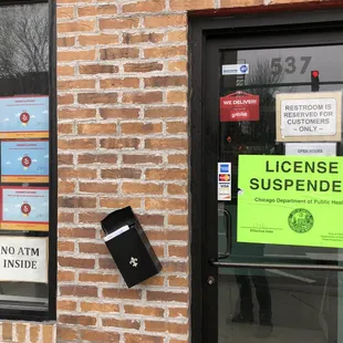 Closed for health code violation sign next to the Yelp congratulatory signs. Hahaha