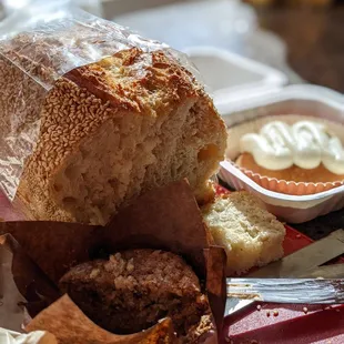 Sesame loaf, banana nut muffin, and cinnamon roll with cream cheese frosting
