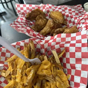 Cheese fries and lemon pepper traditional wings