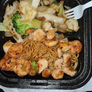 chicken, broccoli, and noodles in a styrofoam container