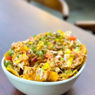 a bowl of nachos on a table