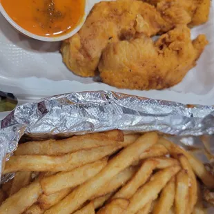 Kids tender meal with fries. Side of sauce.