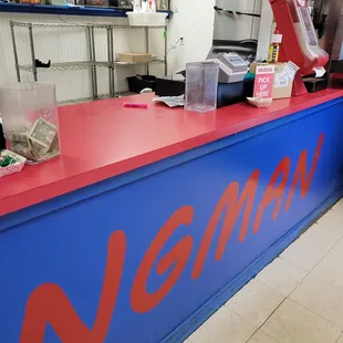 a red and blue counter in a restaurant