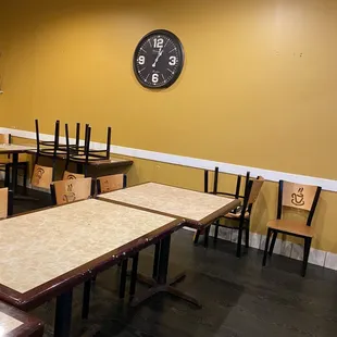 empty tables and chairs in a restaurant